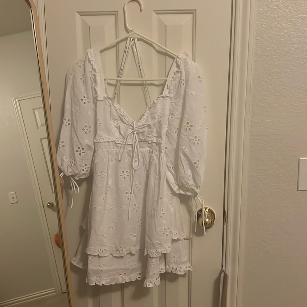 This is a brand new For Love and Lemons dress with tags. It has no flaws.
